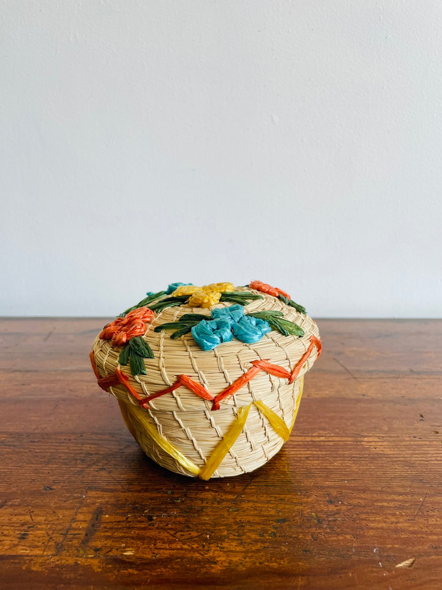 Mini Round Woven Straw Basket with Raffia Flower Design