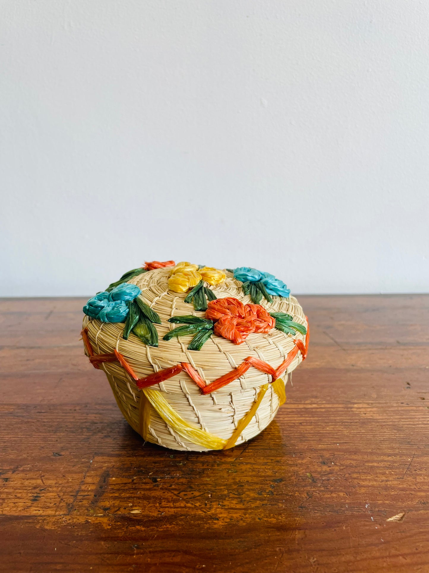 Mini Round Woven Straw Basket with Raffia Flower Design