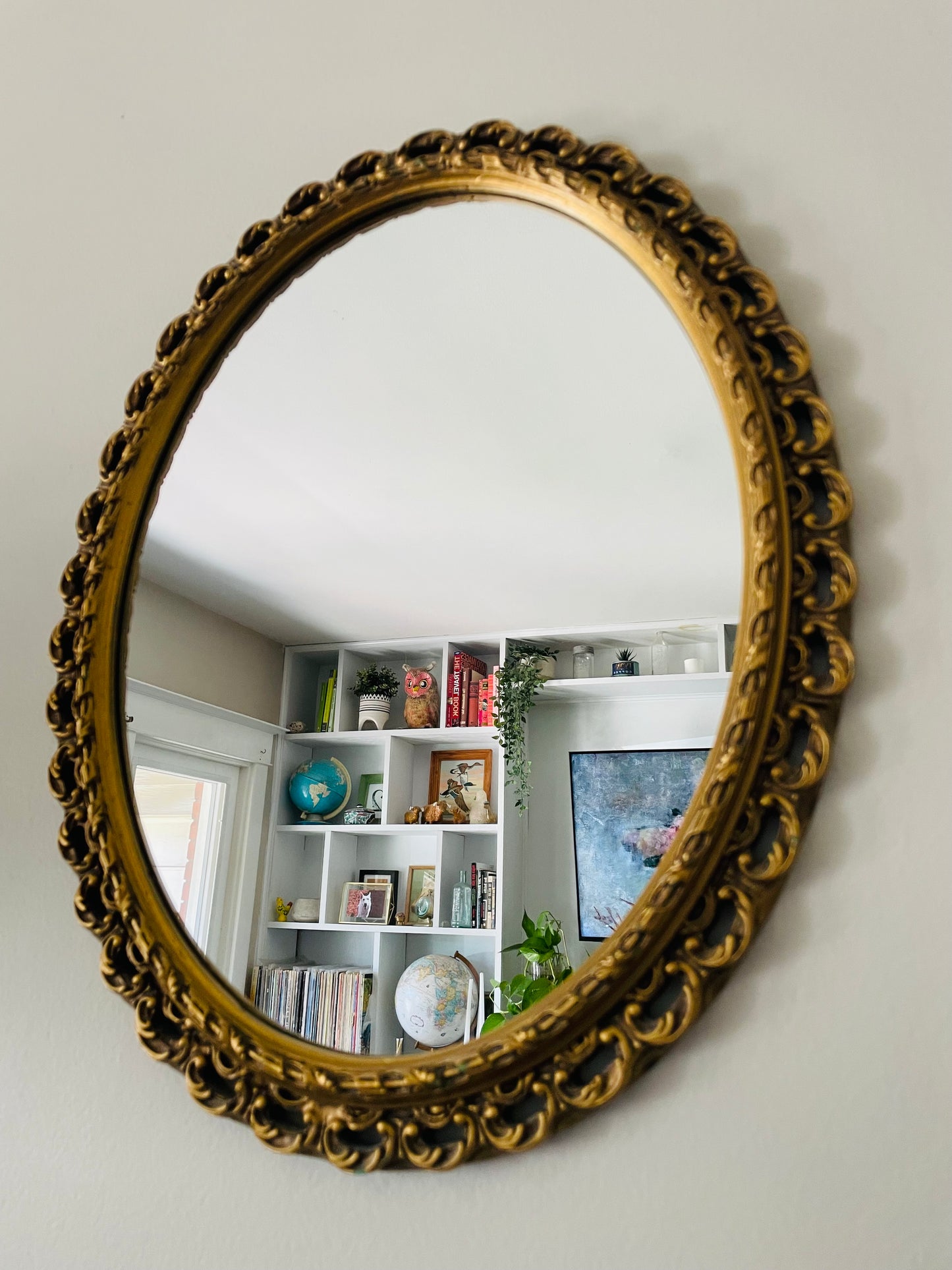 Oval Mirror with Ornate Gold Filigree Design