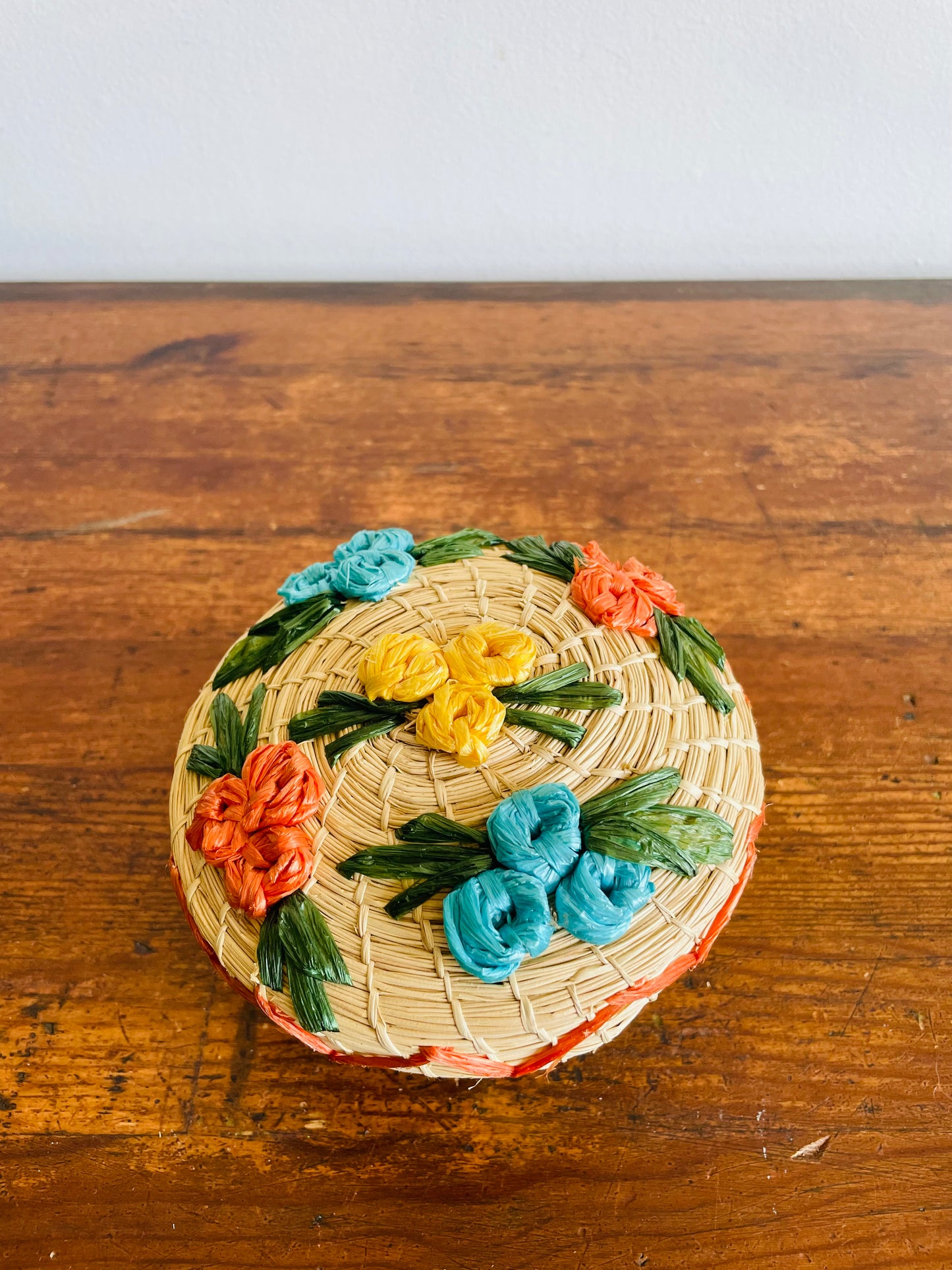 Mini Round Woven Straw Basket with Raffia Flower Design