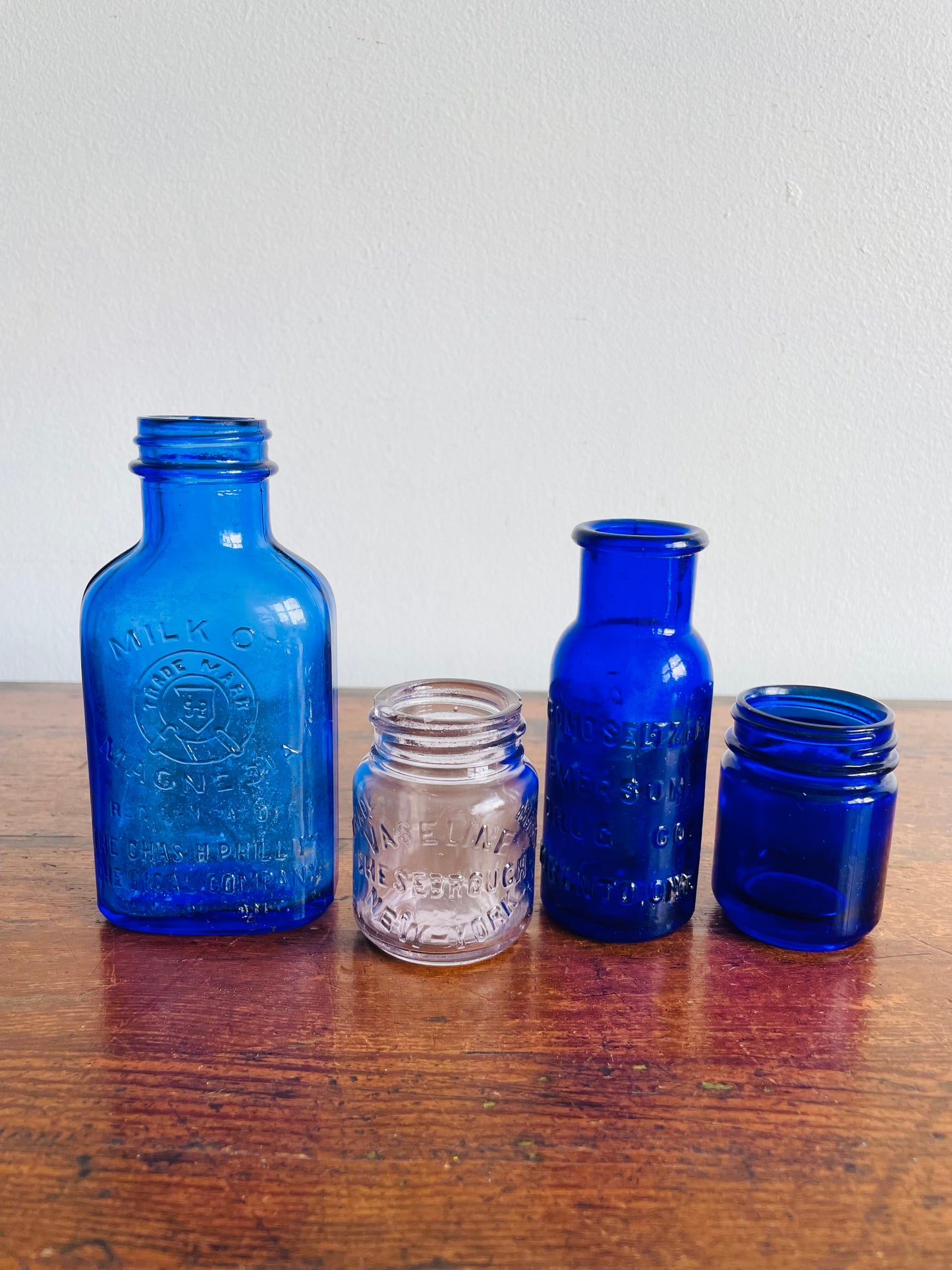 Instant Collection of Cobalt Blue & Clear Medicinal Glass Bottles - Set of 4 - Milk of Magnesia, Bromoseltzer, Vaseline & Vicks