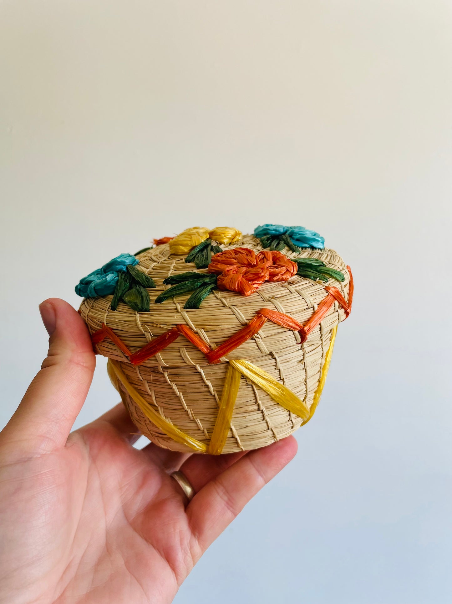 Mini Round Woven Straw Basket with Raffia Flower Design