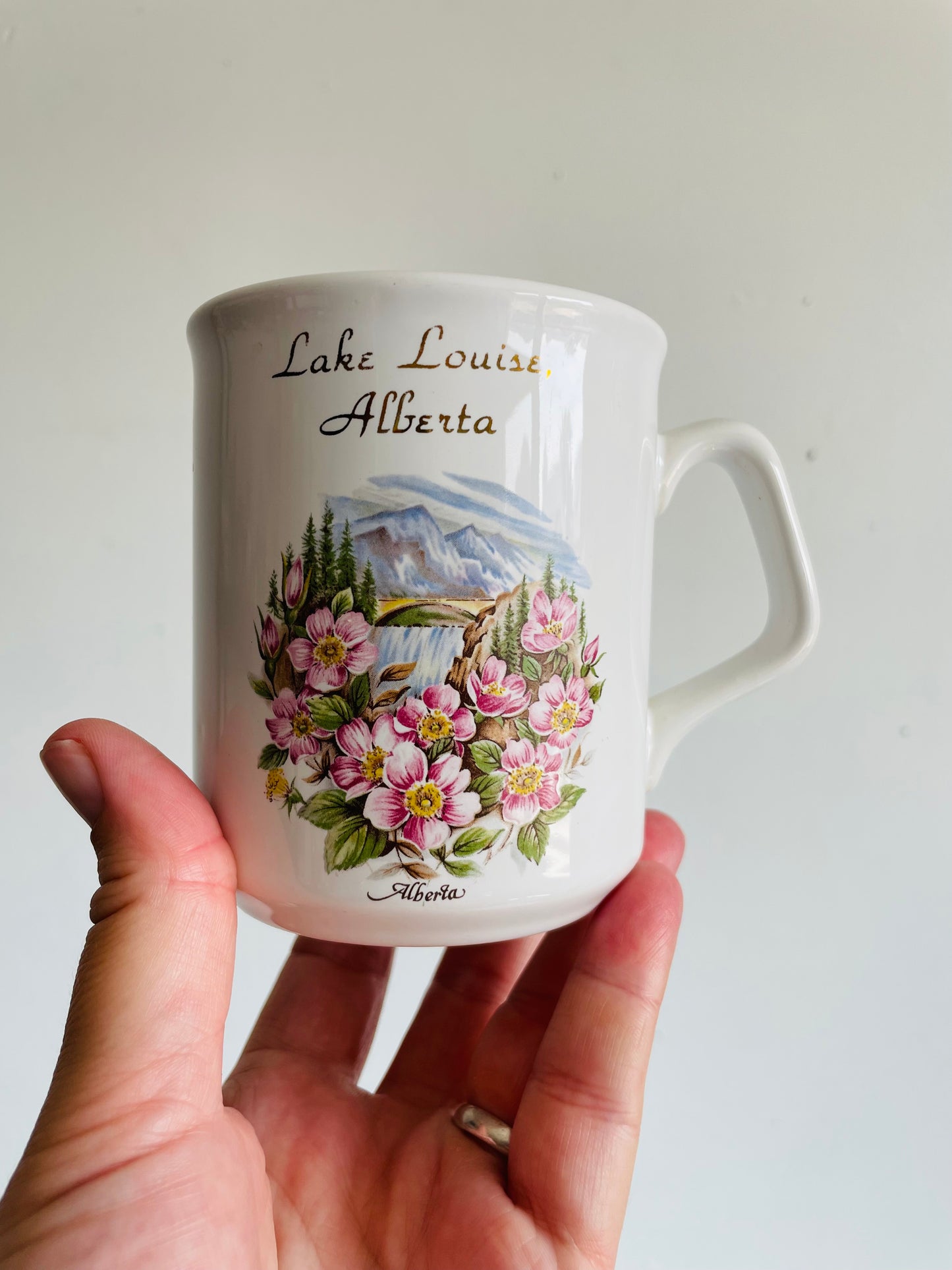 Lake Louise, Alberta White Mug with Flower & Mountain Graphic - Tams Made in England