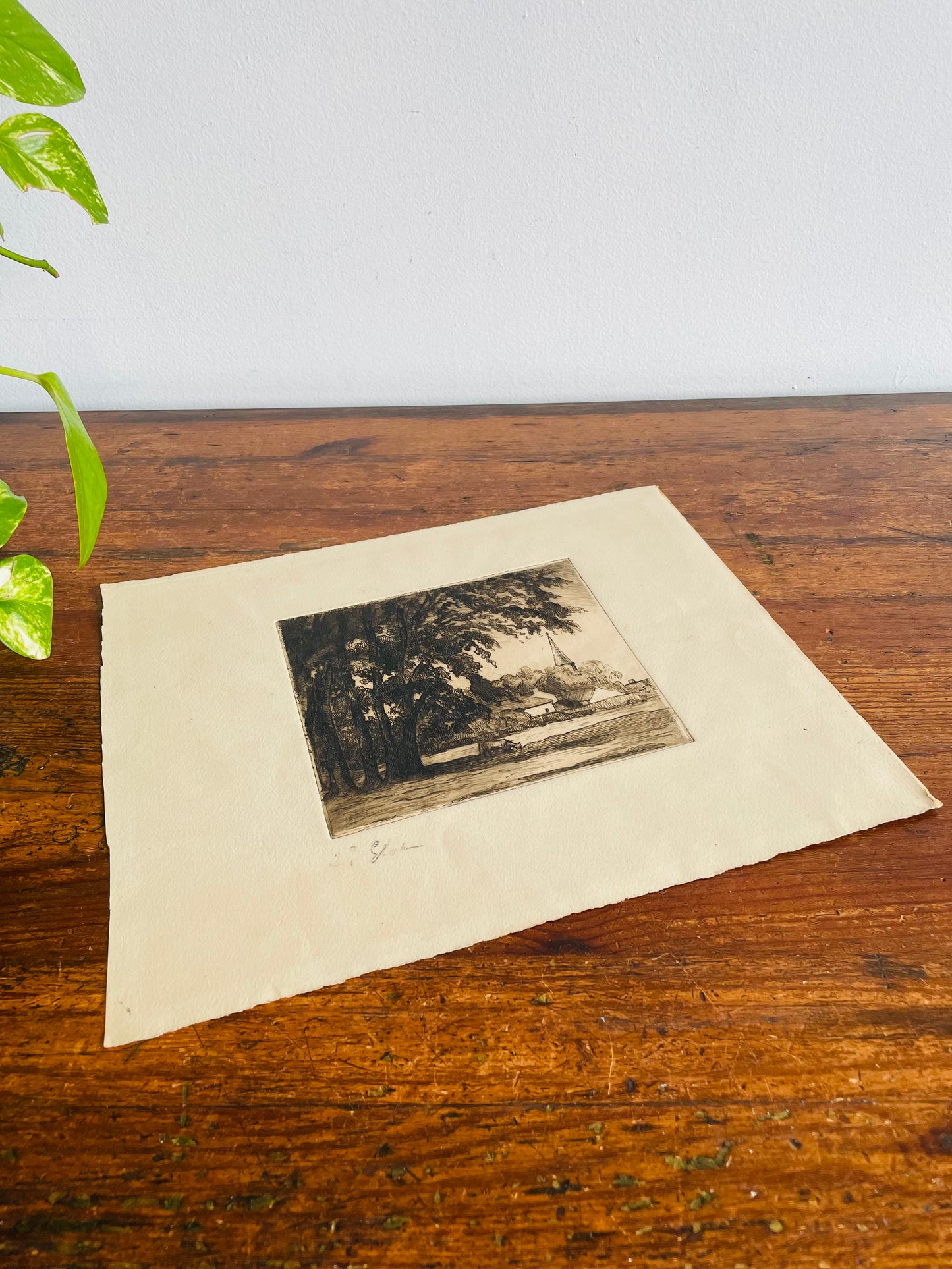 Etched Picture of Cow Grazing Under Tree with Town & Steeple in Background - Artist Signed