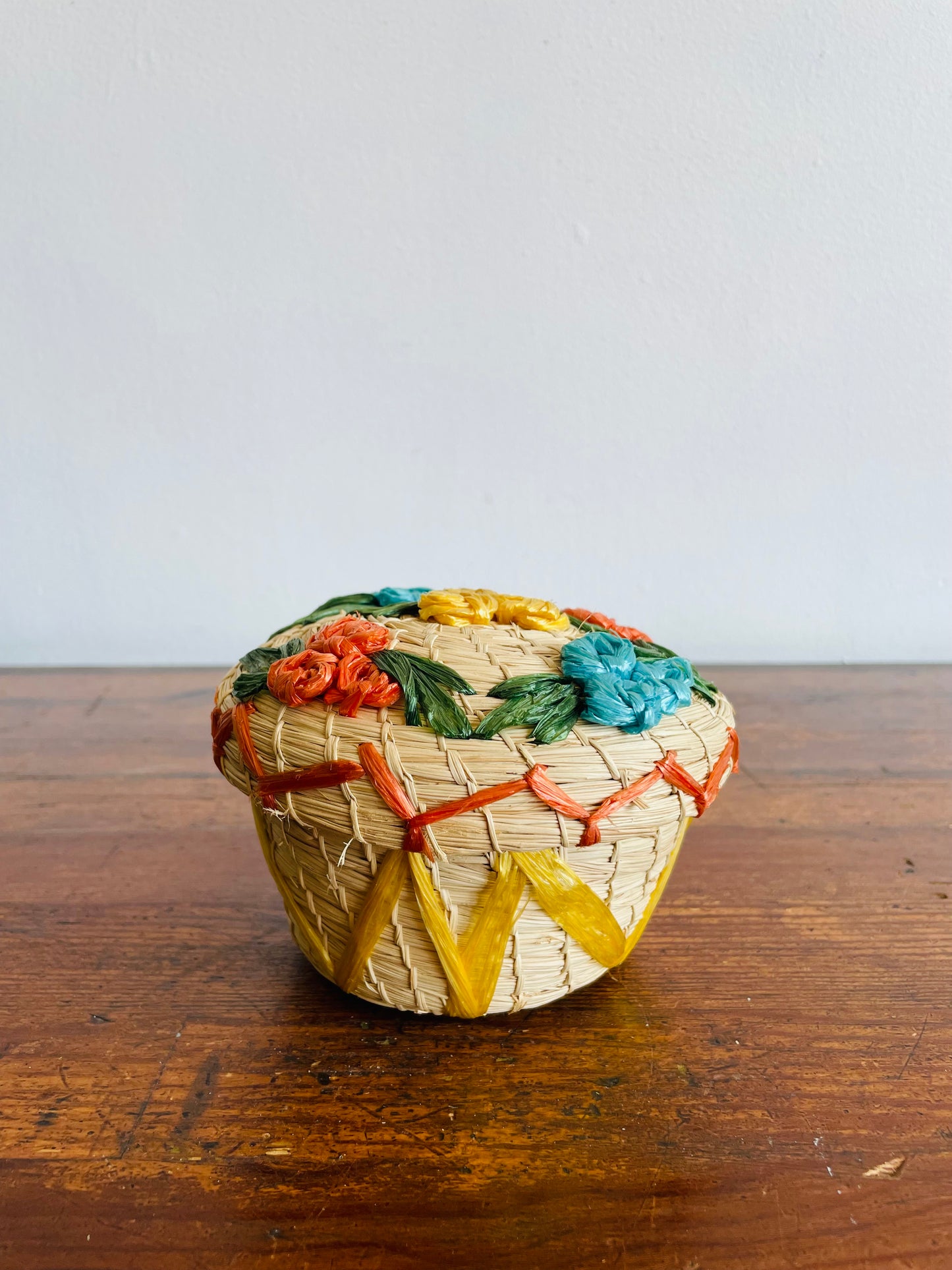 Mini Round Woven Straw Basket with Raffia Flower Design