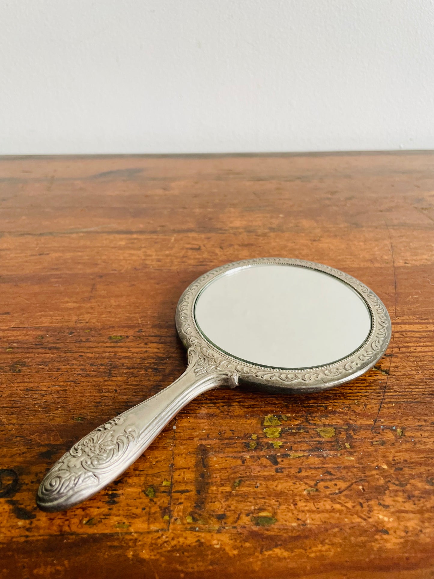 Heavy Round Silver Plate Handheld Vanity Mirror with Ornate Floral Design