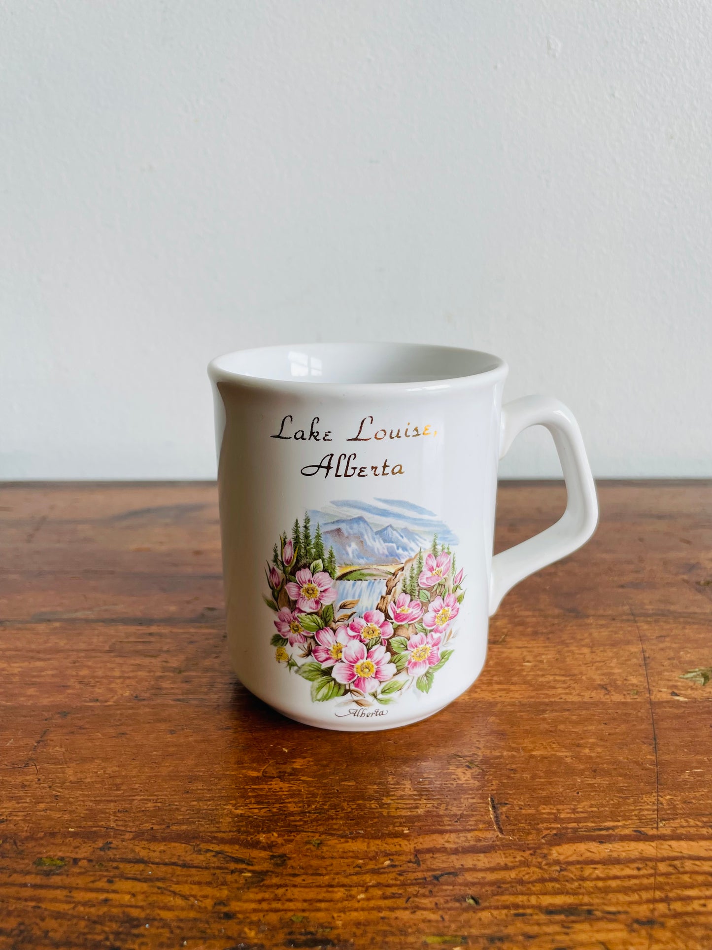Lake Louise, Alberta White Mug with Flower & Mountain Graphic - Tams Made in England