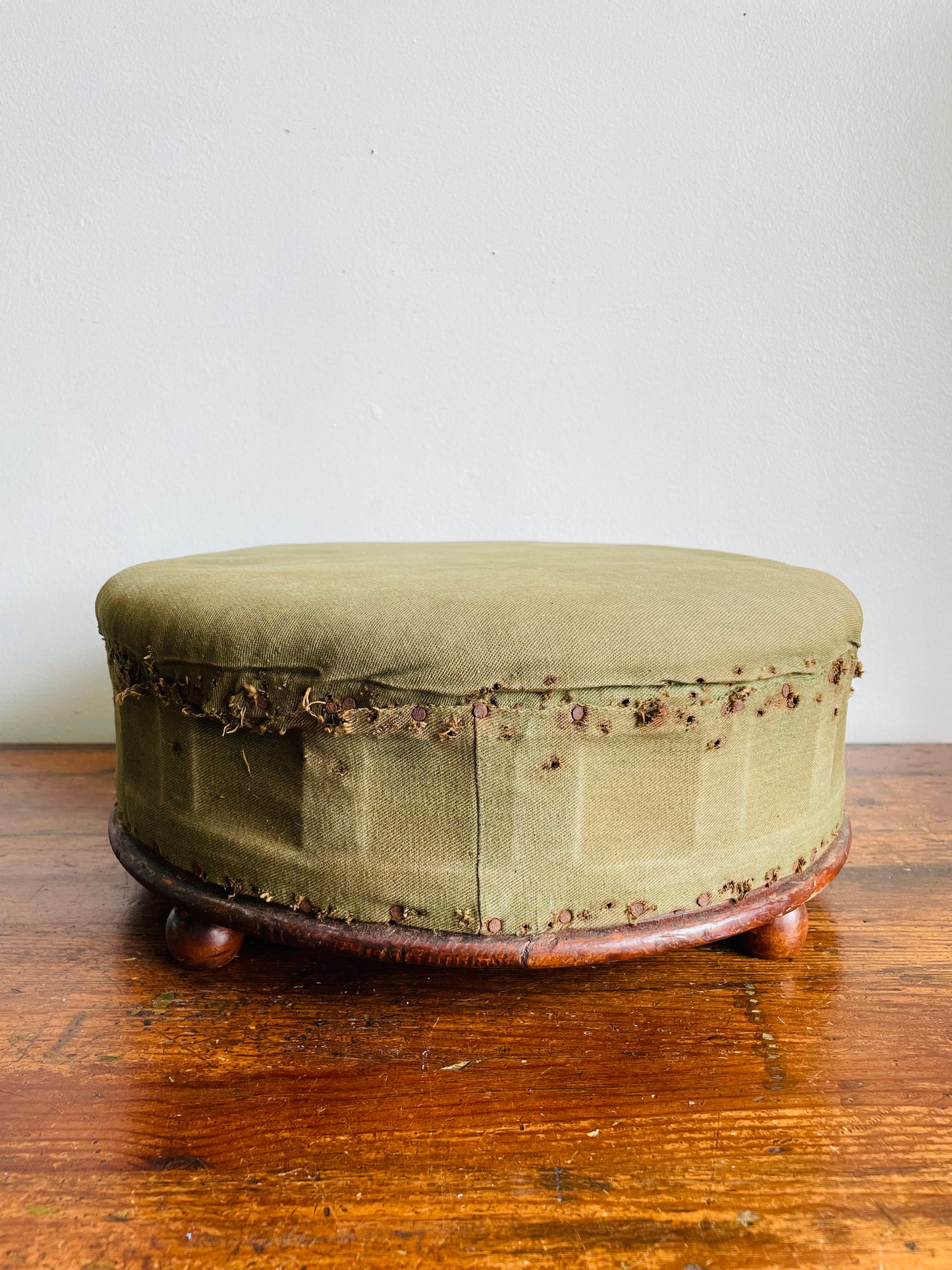 Antique Round Green Straw Stuffed Footstool with Solid Wood Base & Knob Feet
