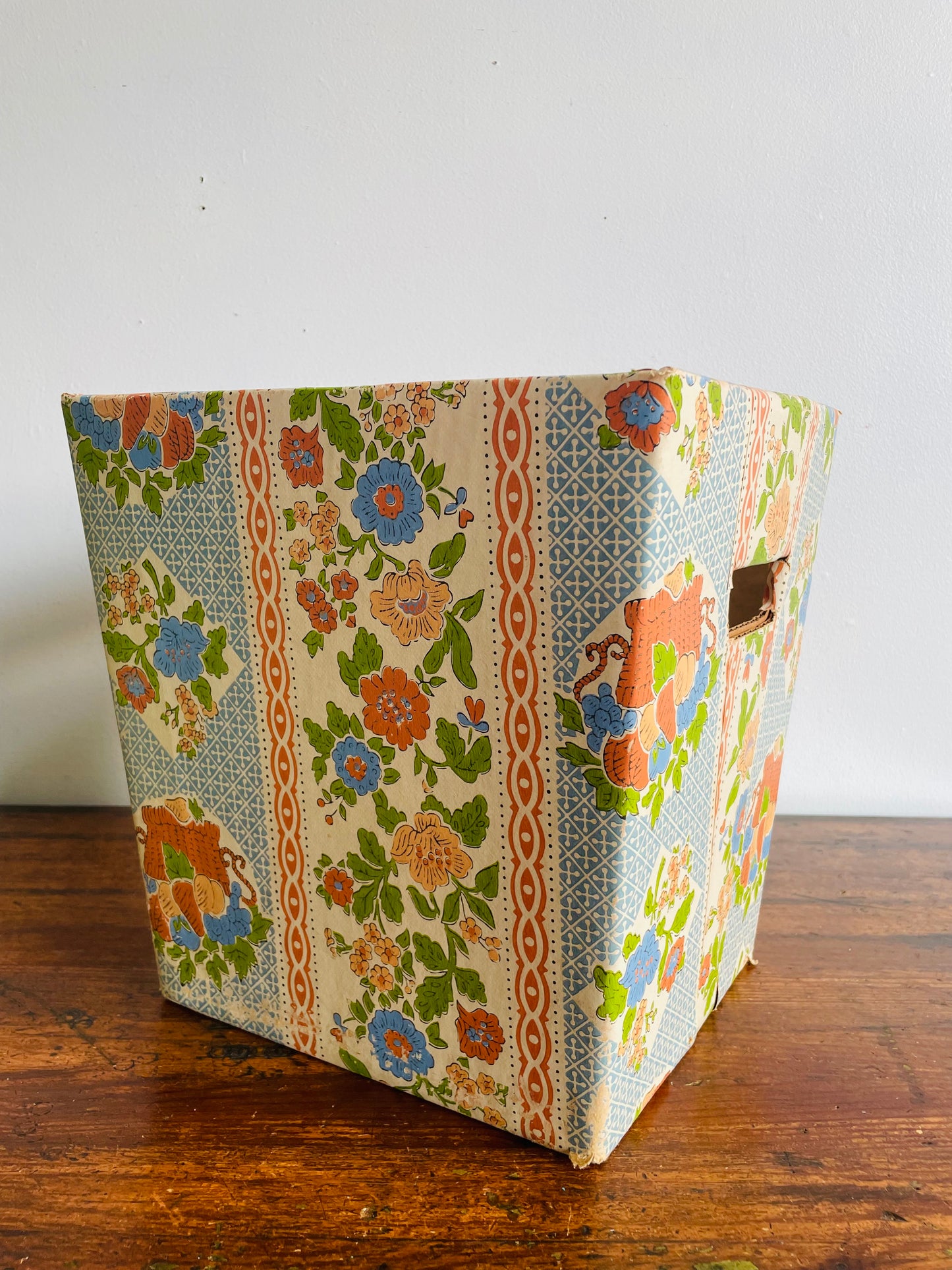 Retro Cardboard Box Trash Can with Flower Pattern Design - Used to Collect Fabric Scraps in a Sewing Crafting Room