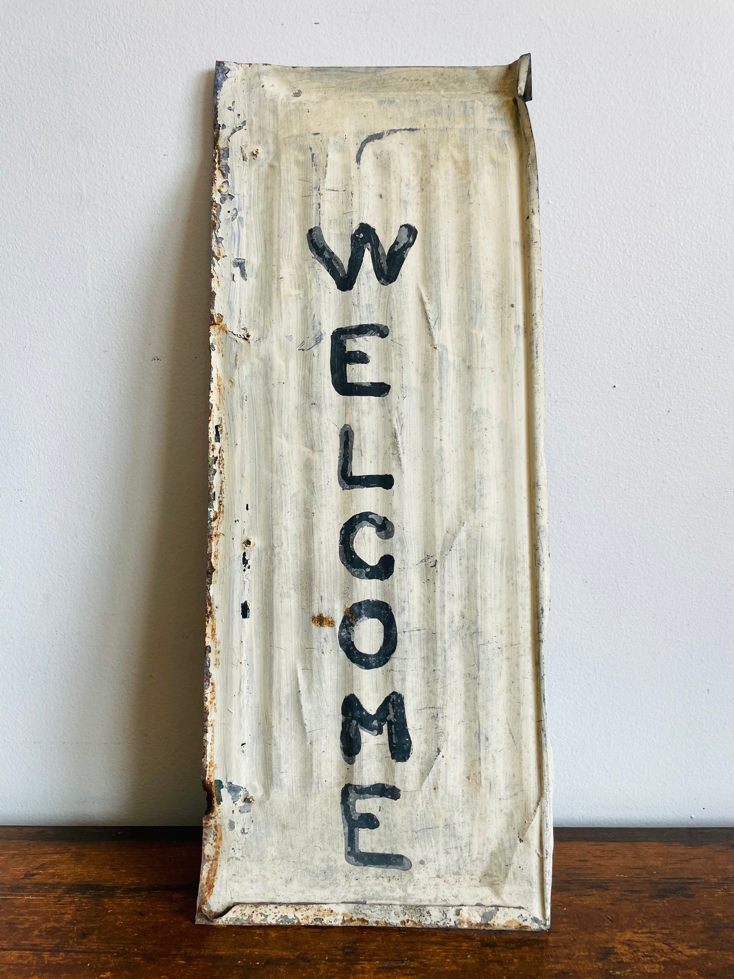 Rustic Hand Painted White & Black Welcome Sign on Metal Background