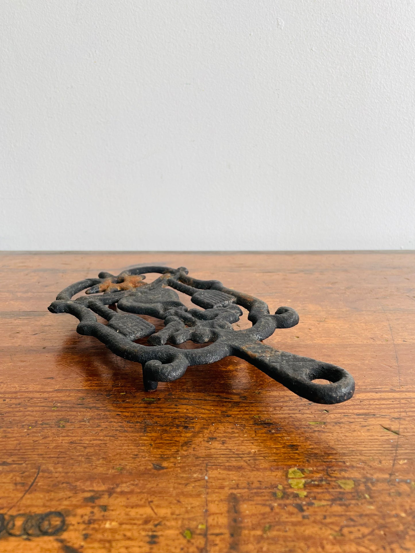 Cast Iron Footed Trivet with Hearts, Brooms, Birds & Star Design