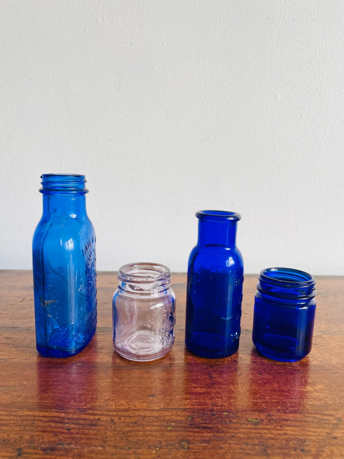 Instant Collection of Cobalt Blue & Clear Medicinal Glass Bottles - Set of 4 - Milk of Magnesia, Bromoseltzer, Vaseline & Vicks