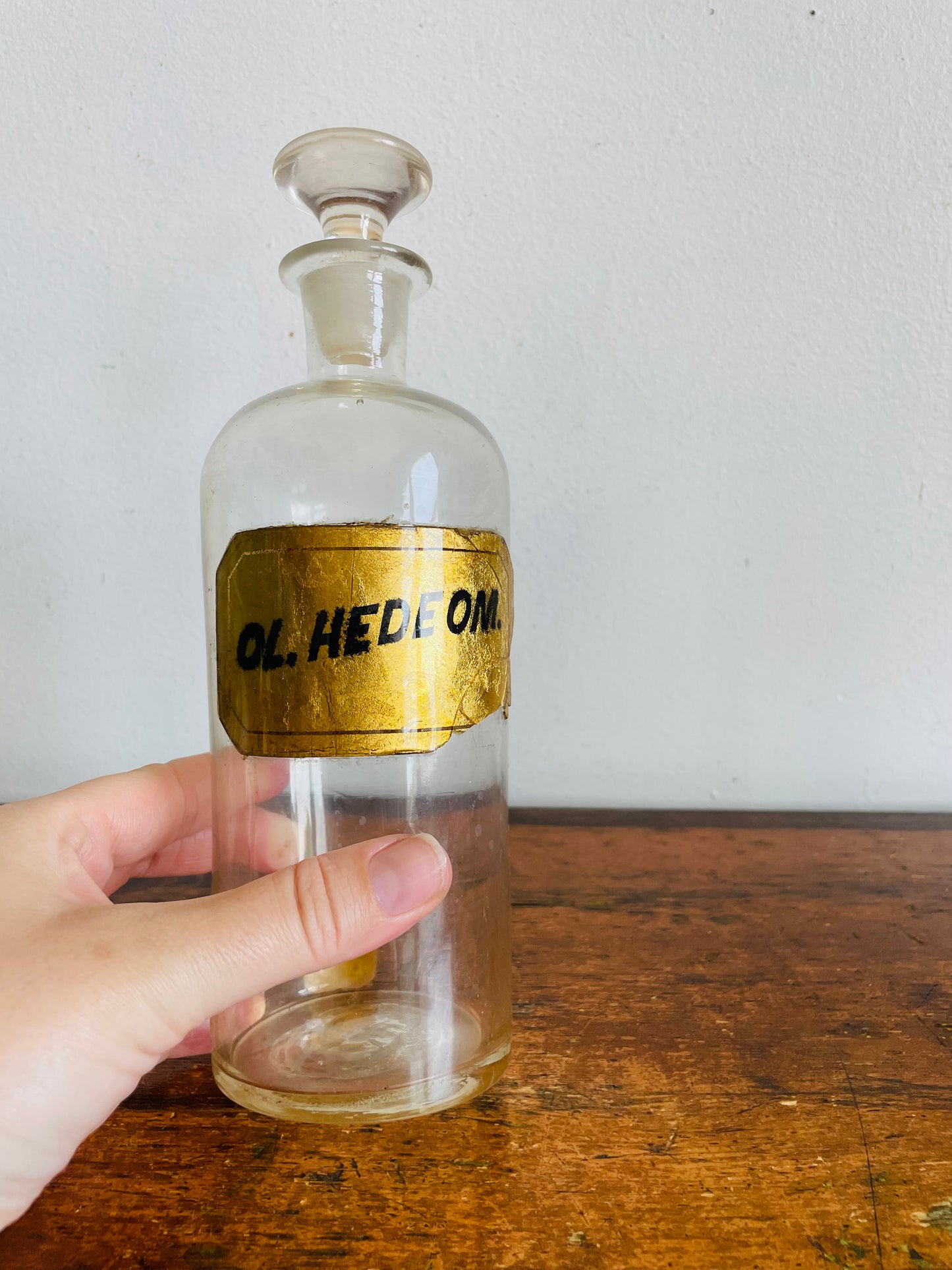 Antique Pharmacy Apothecary Hand Blown Clear Glass Bottle with Lid & Gold Label - Ol. Hedeom