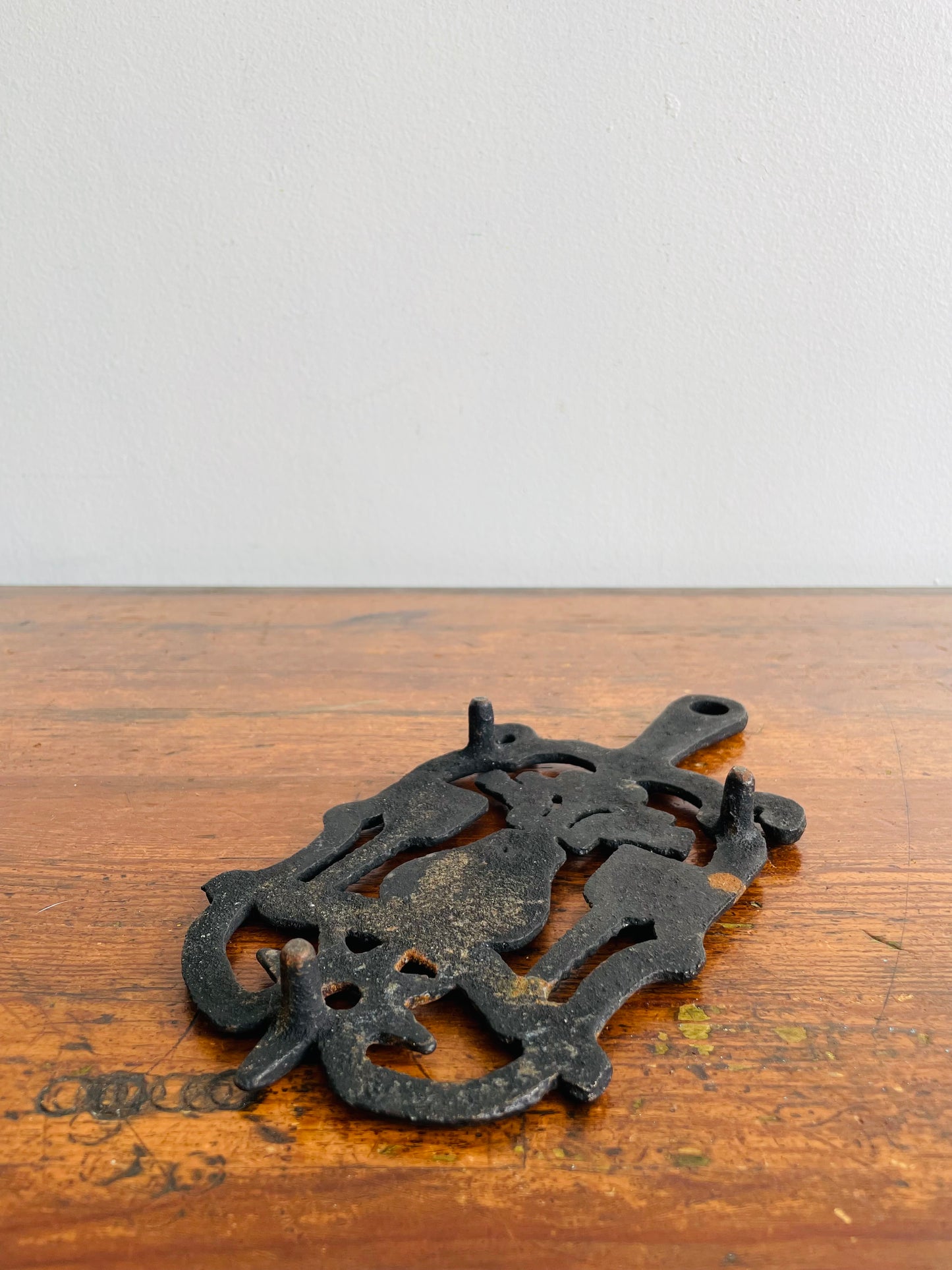 Cast Iron Footed Trivet with Hearts, Brooms, Birds & Star Design