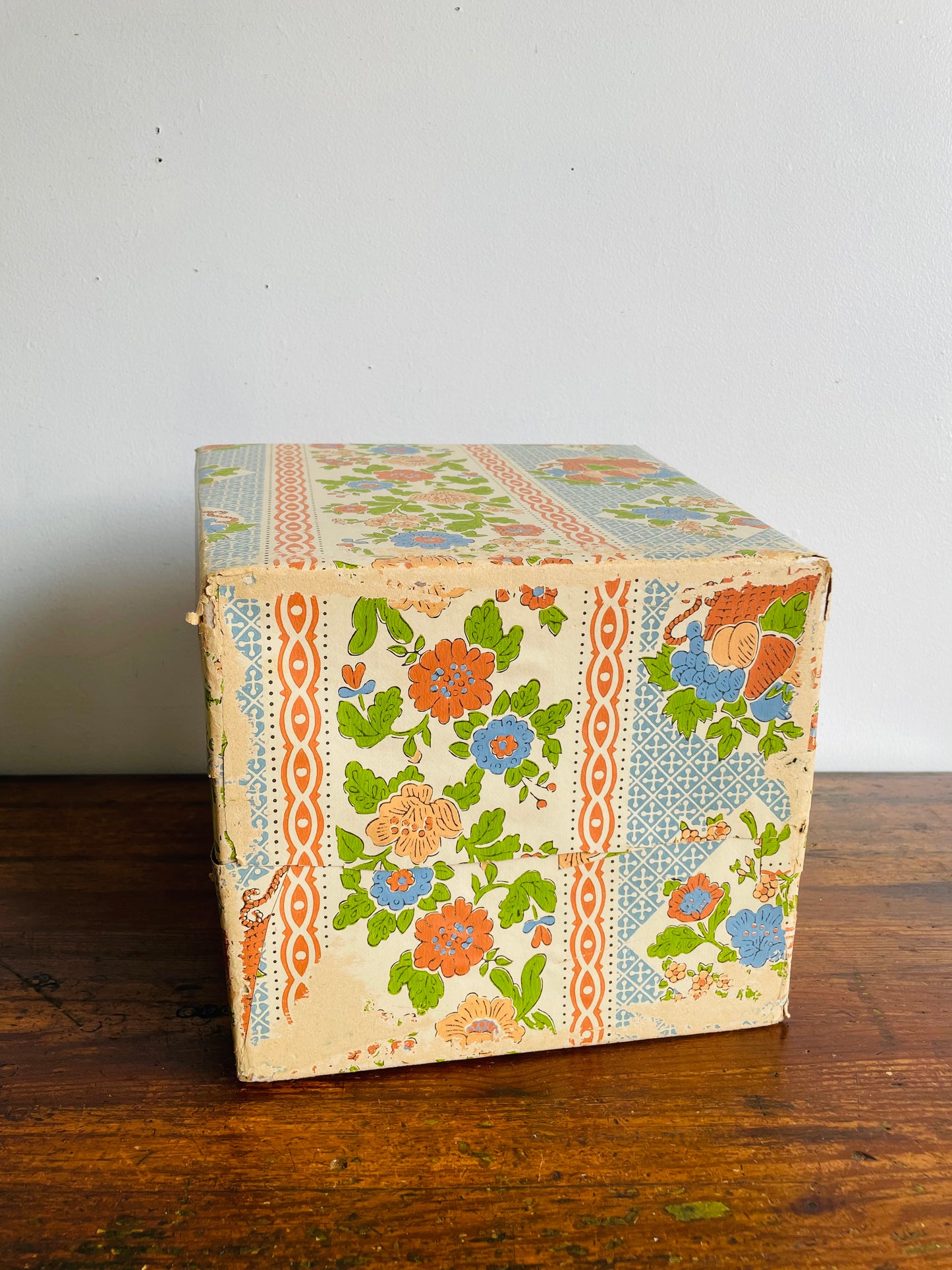 Retro Cardboard Box Trash Can with Flower Pattern Design - Used to Collect Fabric Scraps in a Sewing Crafting Room