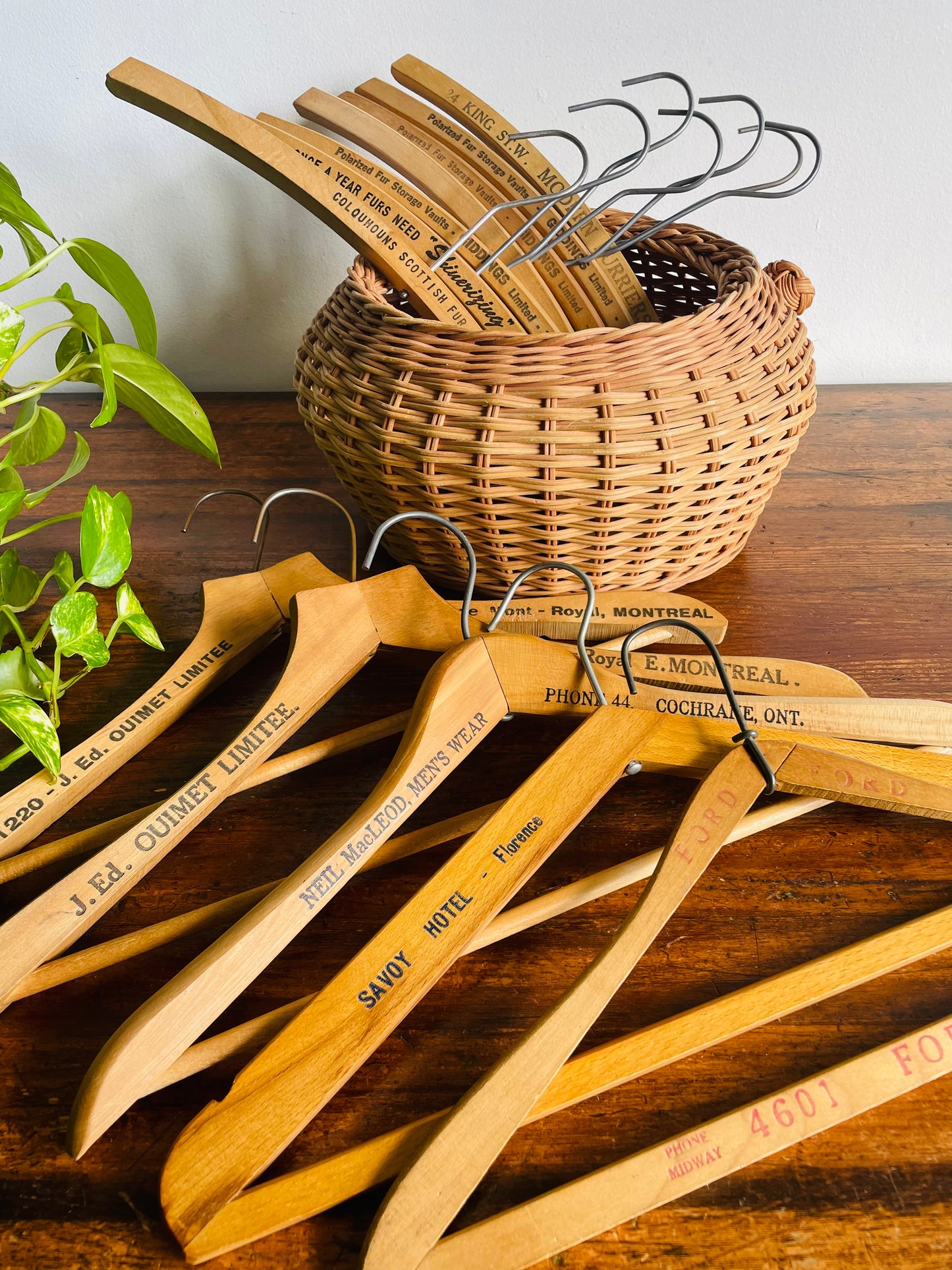 Instant Collection of 12 Wood & Metal Clothes Hangers Stamped with Advertising Slogans