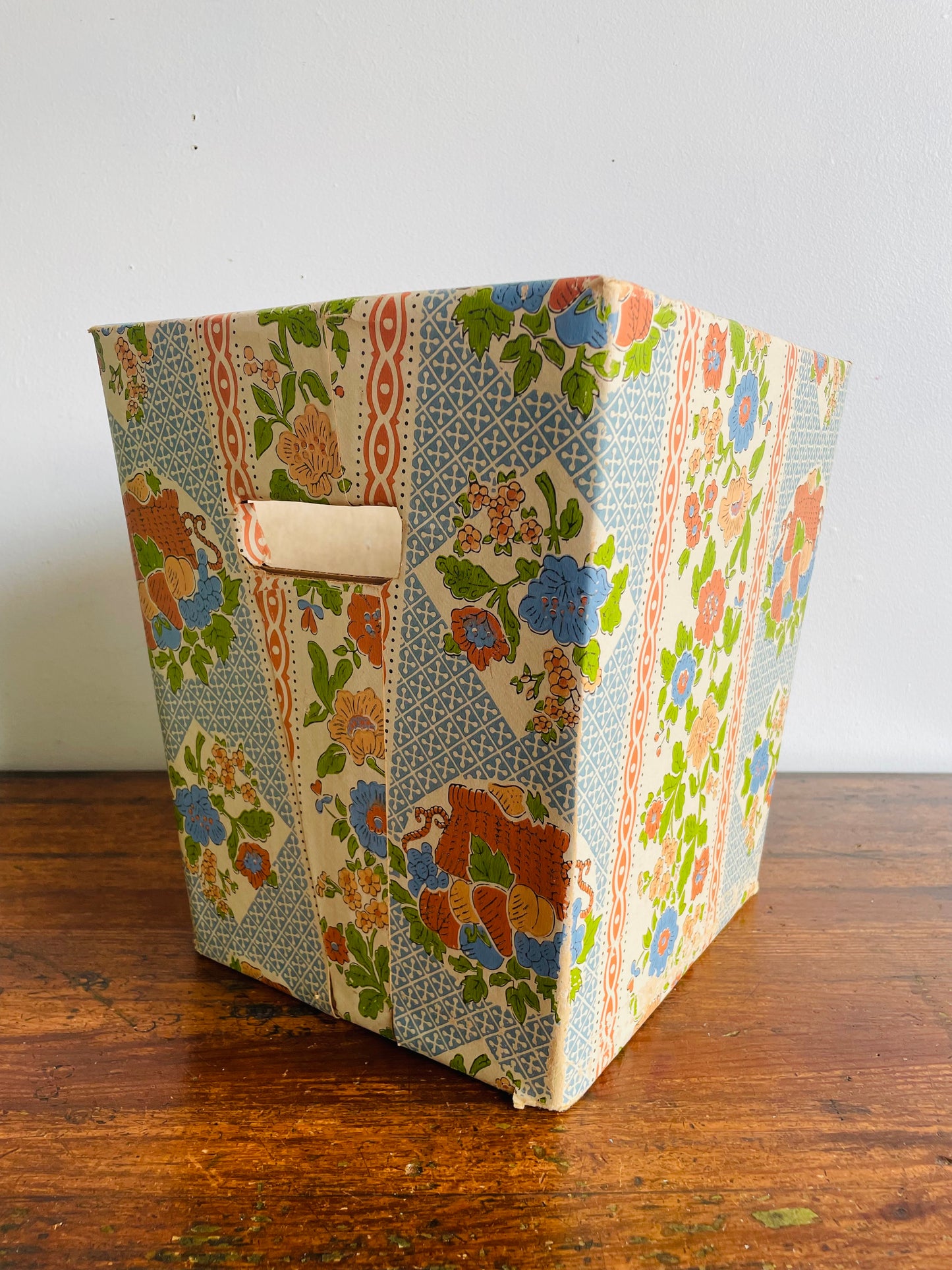 Retro Cardboard Box Trash Can with Flower Pattern Design - Used to Collect Fabric Scraps in a Sewing Crafting Room