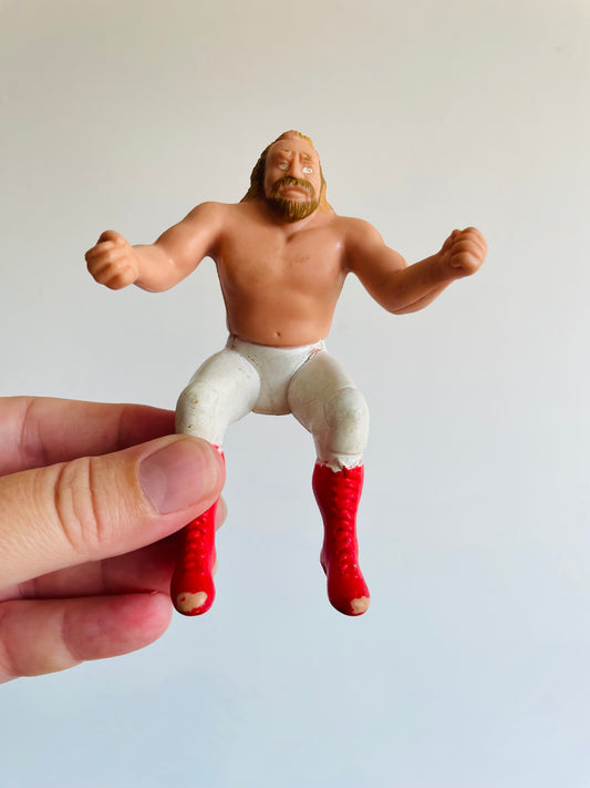 1985 WWE Big John Stud Rubber Thumb Wrestler - Titan Sports Inc.