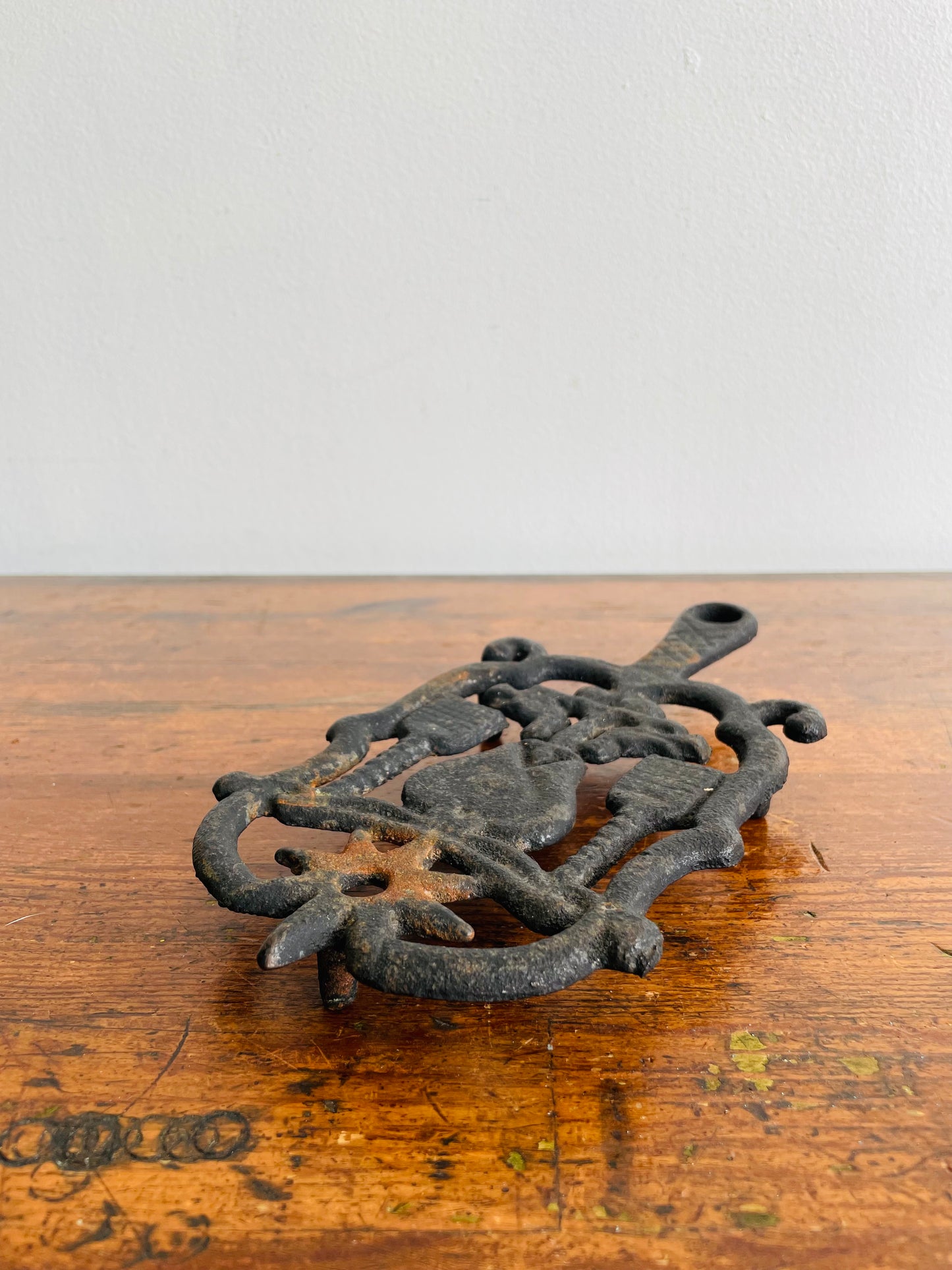 Cast Iron Footed Trivet with Hearts, Brooms, Birds & Star Design