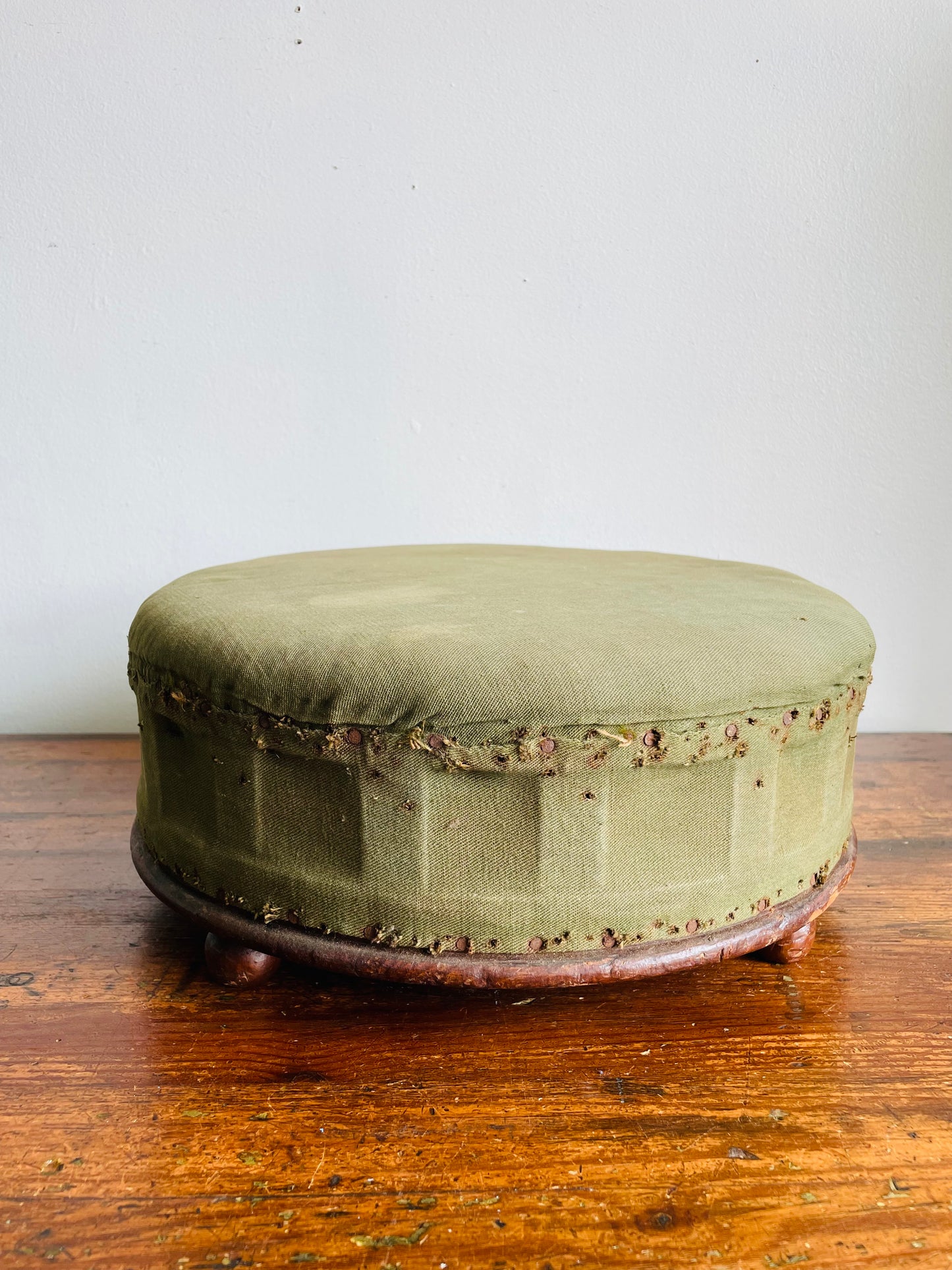 Antique Round Green Straw Stuffed Footstool with Solid Wood Base & Knob Feet