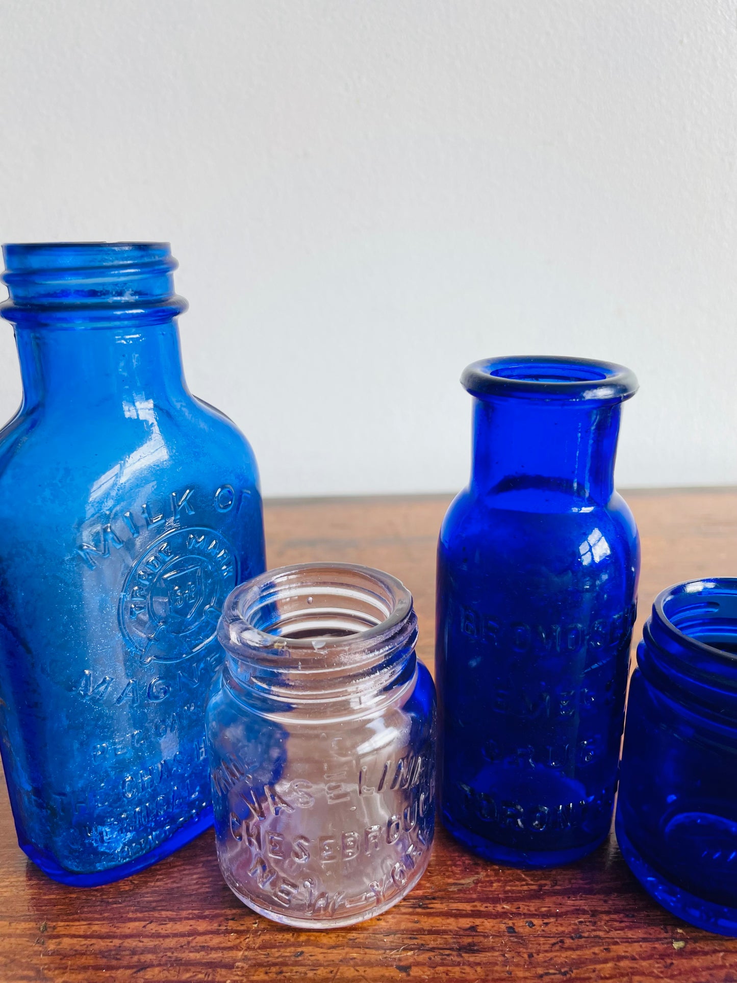 Instant Collection of Cobalt Blue & Clear Medicinal Glass Bottles - Set of 4 - Milk of Magnesia, Bromoseltzer, Vaseline & Vicks