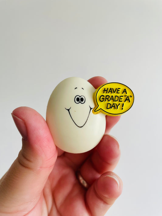 Easter Holiday Pin - Egg Saying Have a Grade A Day! - Hallmark Cards