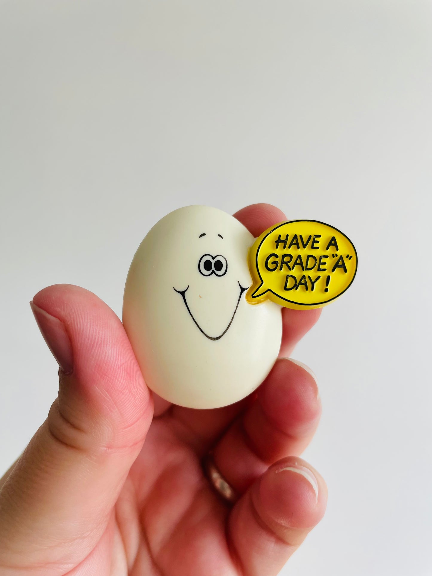 Easter Holiday Pin - Egg Saying Have a Grade A Day! - Hallmark Cards