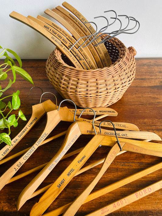 Instant Collection of 12 Wood & Metal Clothes Hangers Stamped with Advertising Slogans