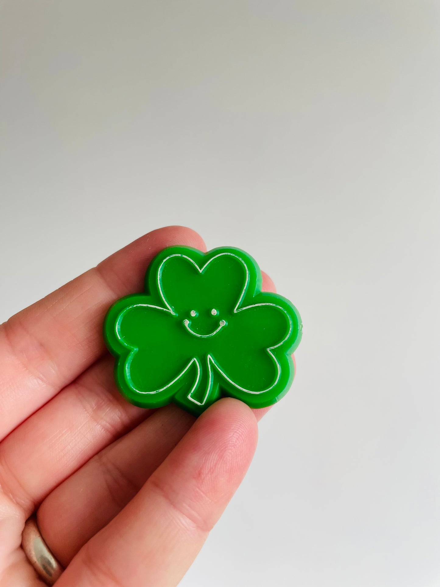 St. Patrick's Day Holiday Pin - Smiley Face Shamrock - Hallmark Cards Inc.