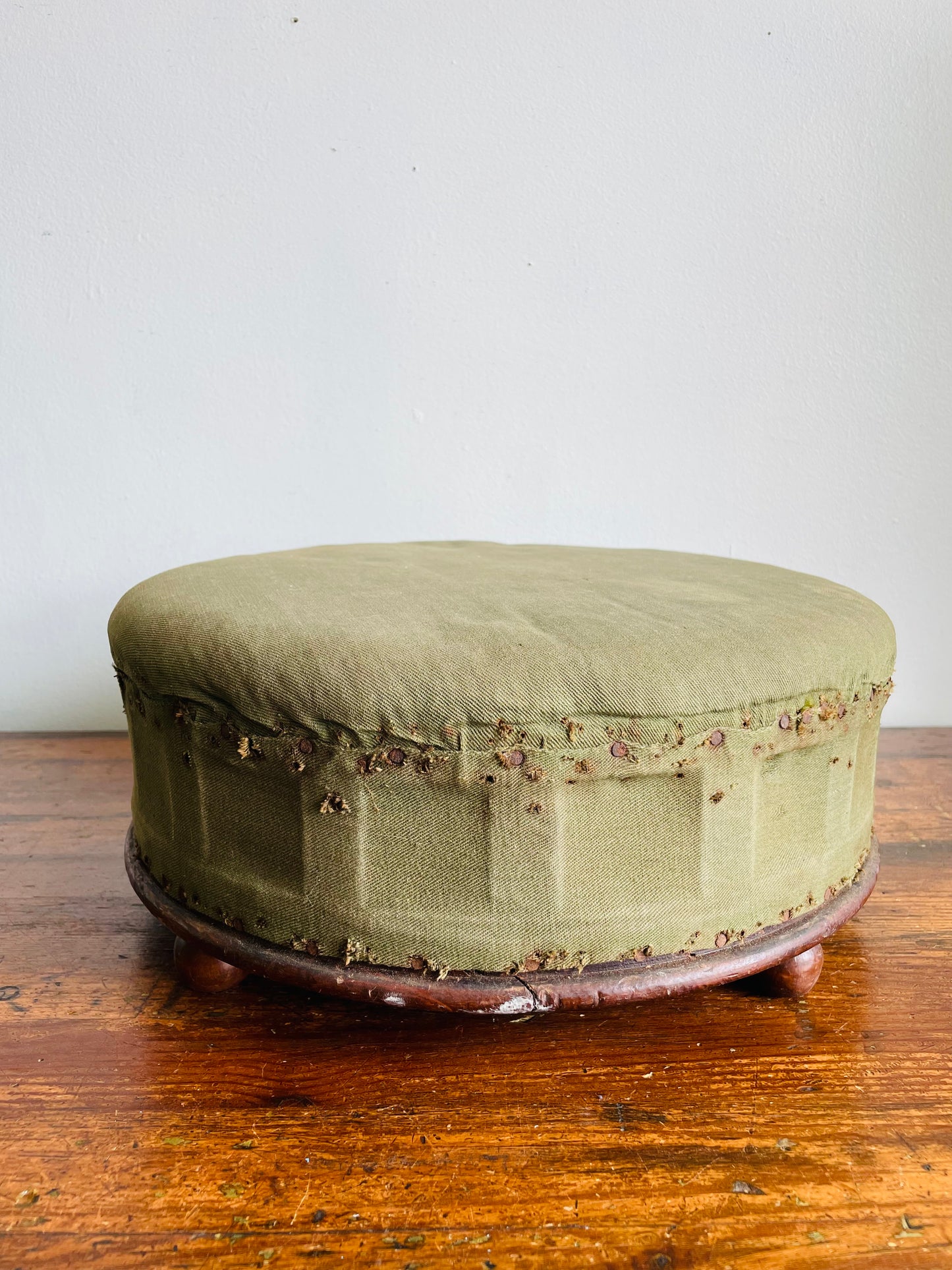 Antique Round Green Straw Stuffed Footstool with Solid Wood Base & Knob Feet