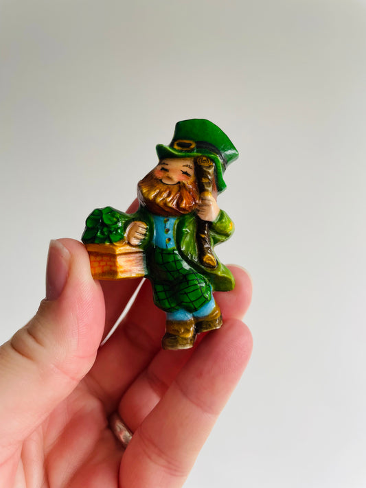 St. Patrick's Day Holiday Pin - Cheerful Leprechaun with Basket of Shamrocks - Hallmark Cards Inc.