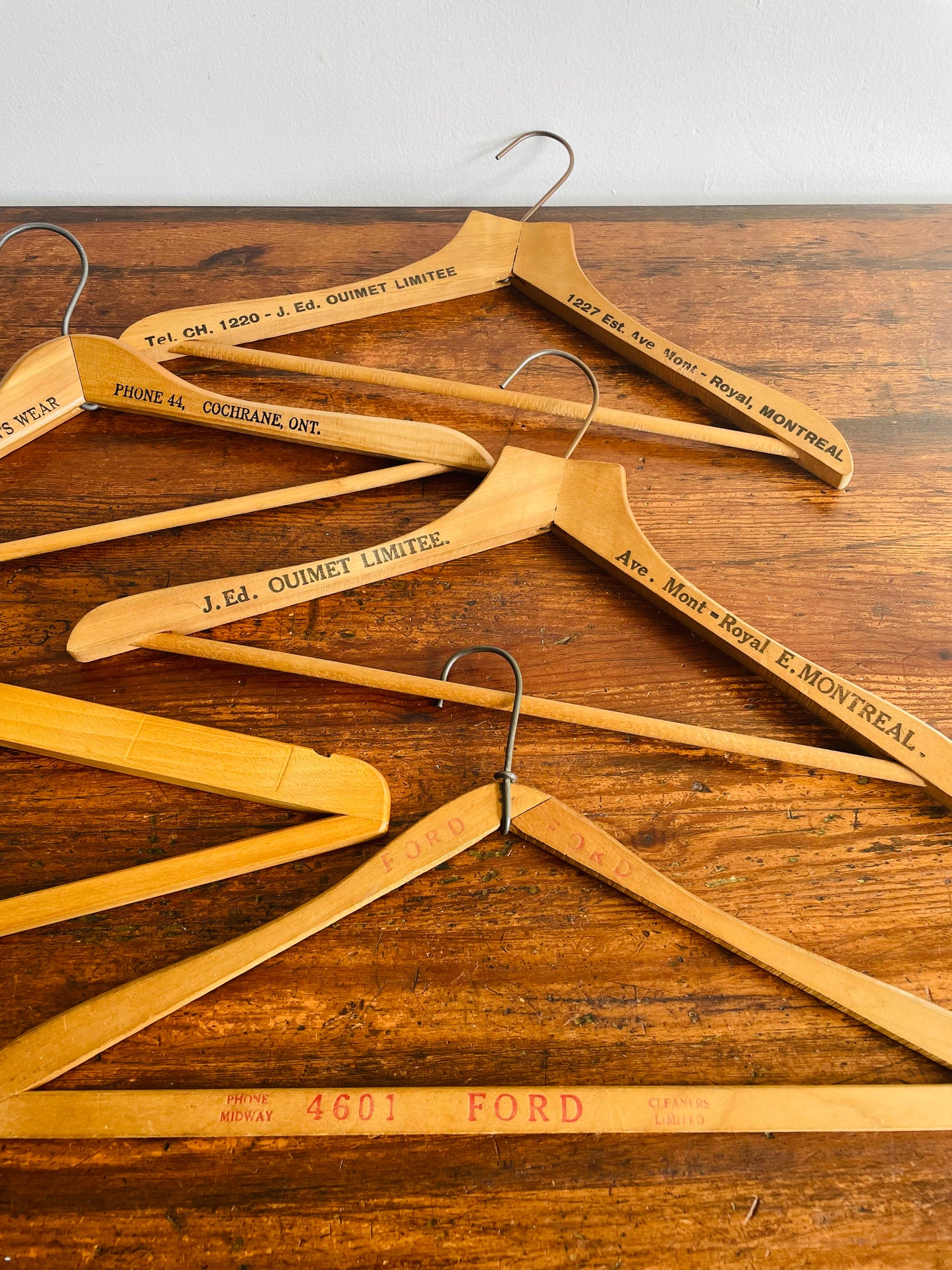 Instant Collection of 12 Wood & Metal Clothes Hangers Stamped with Advertising Slogans