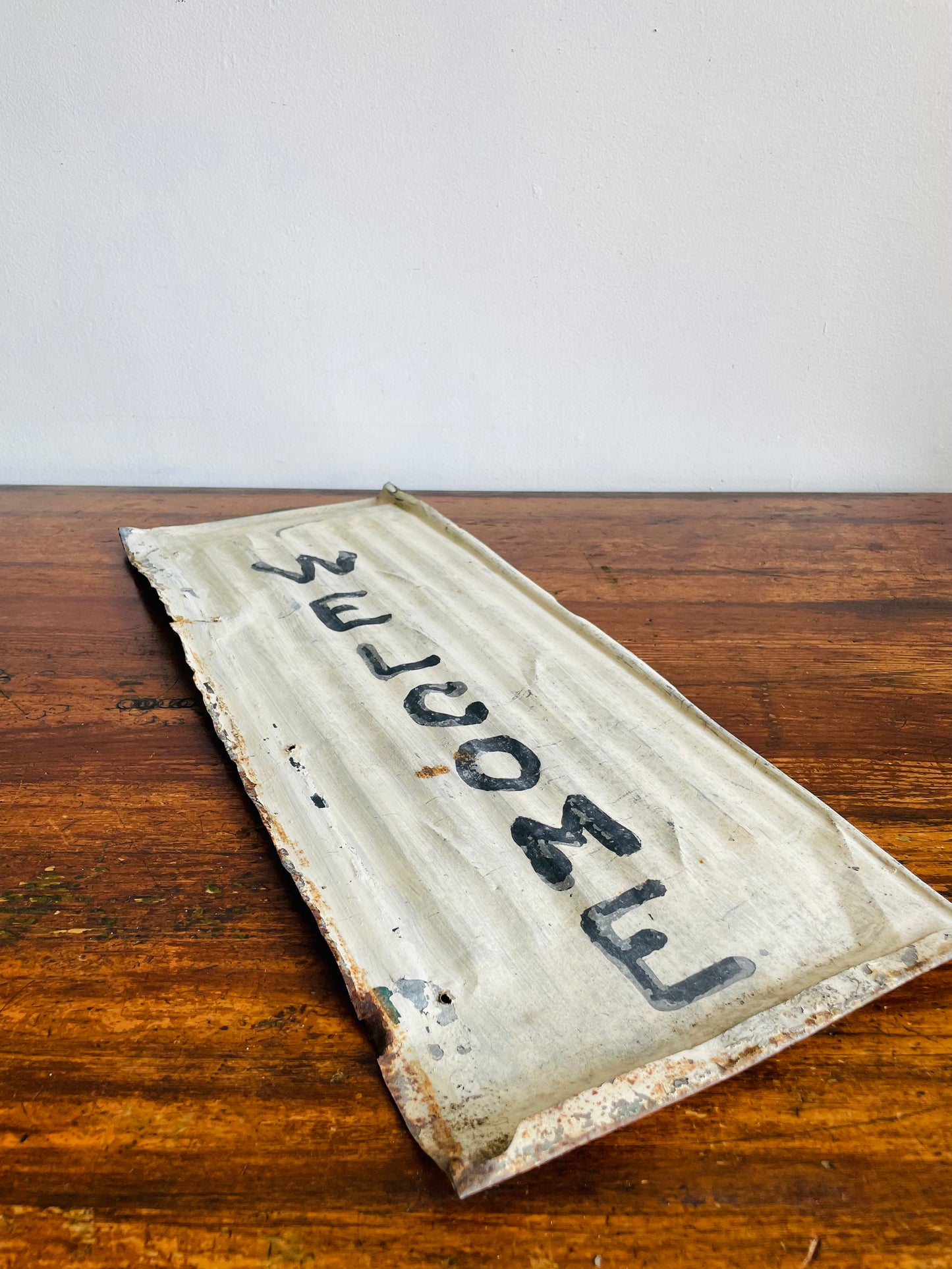 Rustic Hand Painted White & Black Welcome Sign on Metal Background