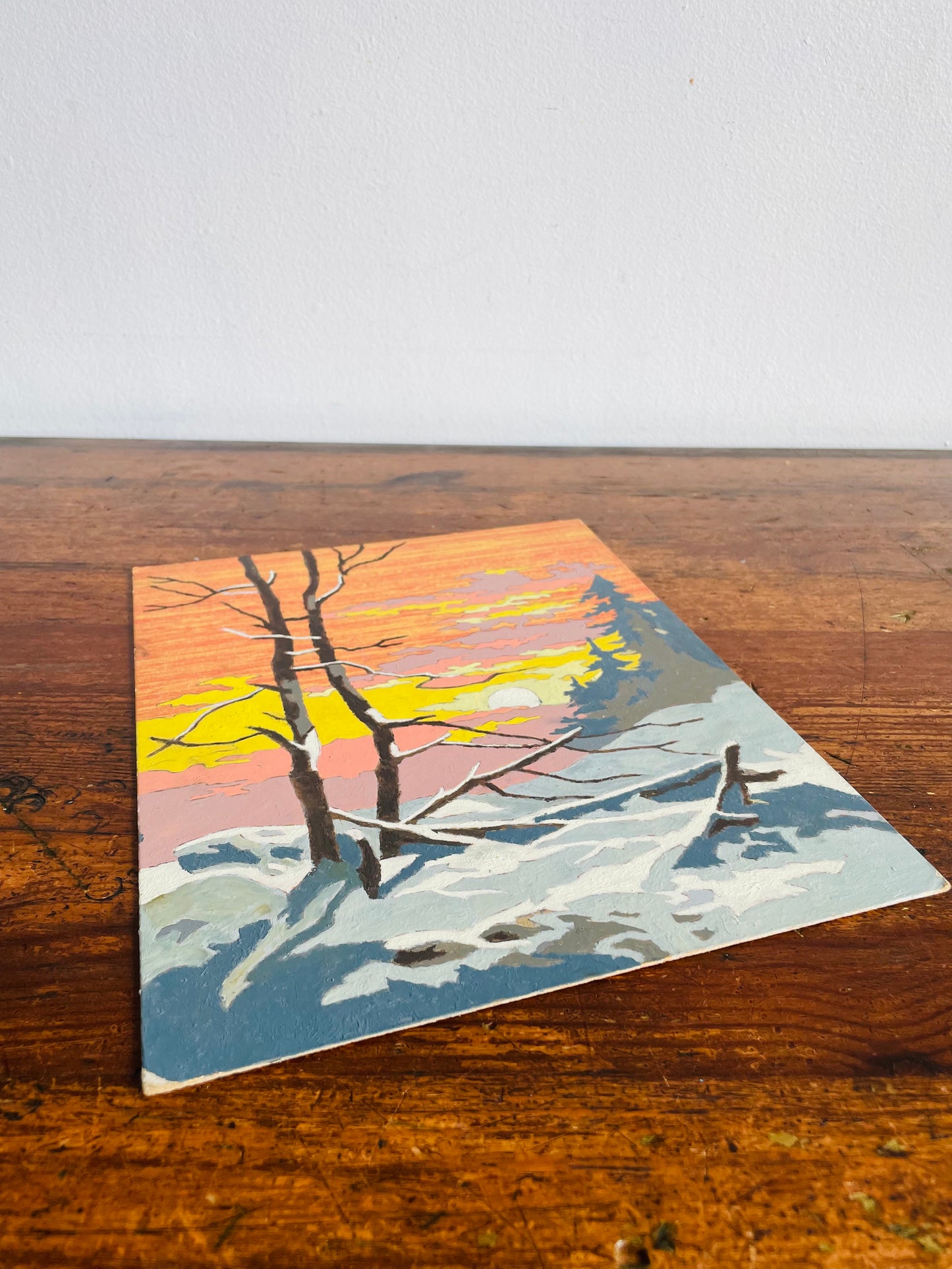 Vintage 1960s Paint by Number (PBN) Picture on Board of Sunrise or Sunset Over Snowy Forest - 8" x 10"