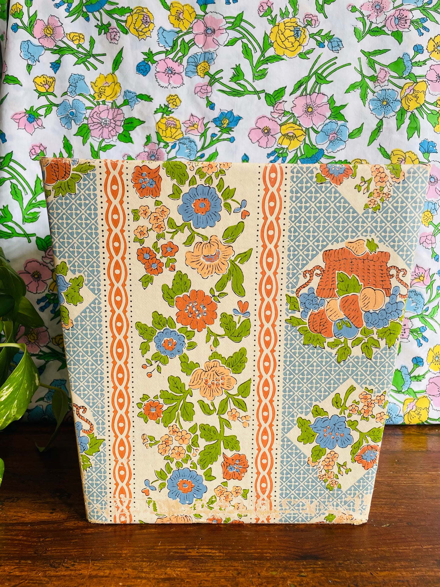 Retro Cardboard Box Trash Can with Flower Pattern Design - Used to Collect Fabric Scraps in a Sewing Crafting Room