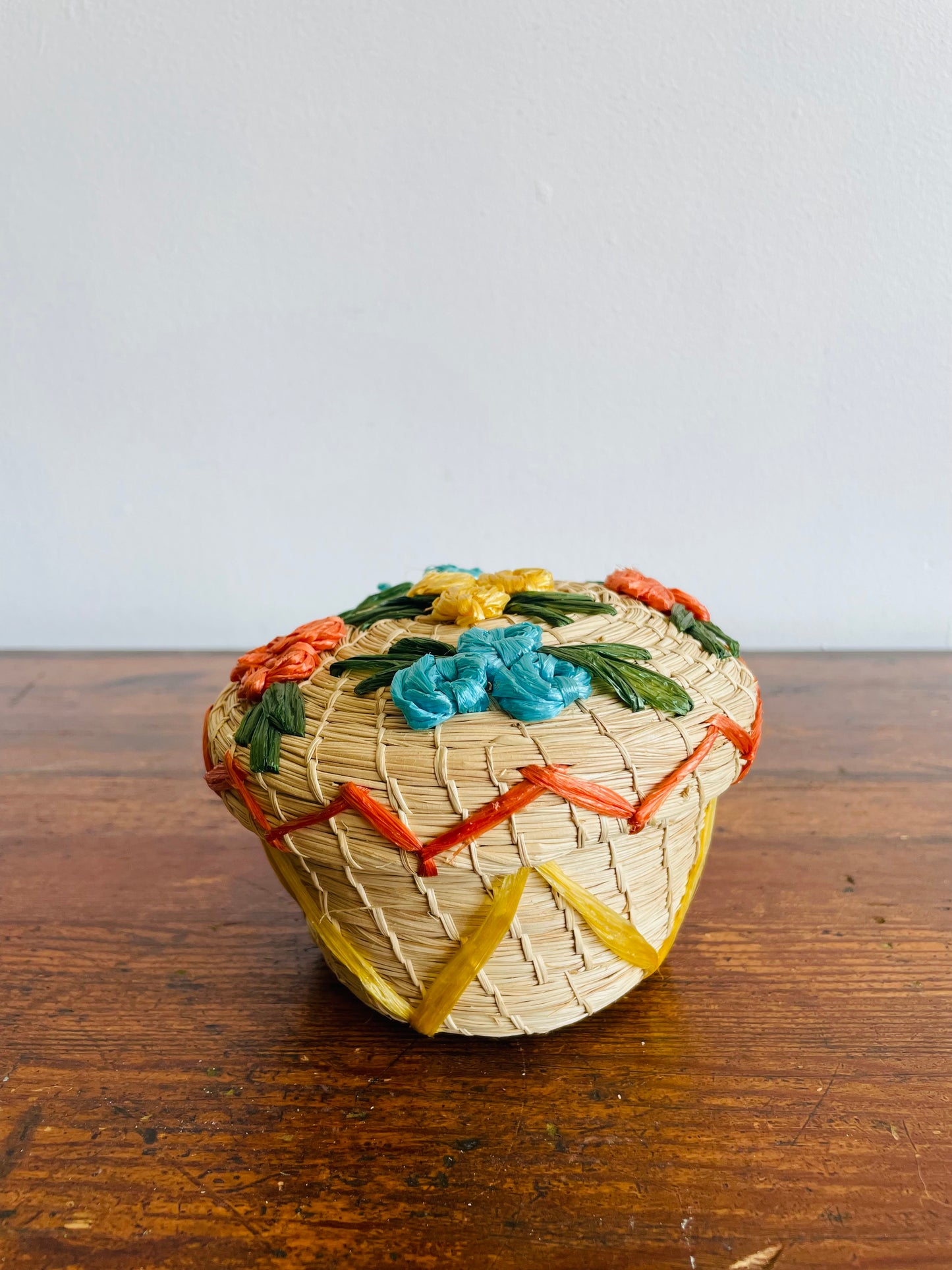 Mini Round Woven Straw Basket with Raffia Flower Design